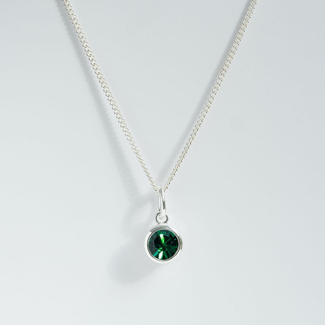 Silver emerald charm pendant