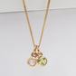 Moonstone and peridot birthstone charms on a chain